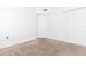 Bedroom with neutral carpet, white walls, and double door closet at 9524 Newdale Way # 101, Riverview, FL 33578
