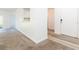 A cozy living room featuring carpeting, a ceiling fan, and access to the outdoors at 9524 Newdale Way # 101, Riverview, FL 33578