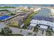 Condominium building with waterfront boat docks and green spaces, offering picturesque views and recreation at 1 Boca Ciega Point Blvd # 310, St Petersburg, FL 33708