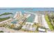 An aerial view of condos with boat docks, tennis courts, mature trees and beautifully maintained landscaping at 1 Boca Ciega Point Blvd # 310, St Petersburg, FL 33708