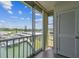 Balcony with sliding glass doors that offer beautiful water views and access to the outdoors at 1 Boca Ciega Point Blvd # 310, St Petersburg, FL 33708