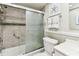 Clean bathroom featuring tiled shower and vanity with sink, offering a relaxing and updated space at 1 Boca Ciega Point Blvd # 310, St Petersburg, FL 33708
