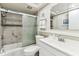 Modern bathroom featuring tile shower and vanity with sink, offering a clean and updated space at 1 Boca Ciega Point Blvd # 310, St Petersburg, FL 33708