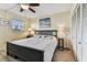 Cozy bedroom featuring a ceiling fan, closet, and natural light at 1 Boca Ciega Point Blvd # 310, St Petersburg, FL 33708