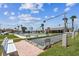 Community amenities with a bocce ball court surrounded by lush landscaping and seating areas at 1 Boca Ciega Point Blvd # 310, St Petersburg, FL 33708