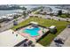 Enjoy this uniquely shaped community pool with ample chairs and umbrellas in a lush, tropical setting at 1 Boca Ciega Point Blvd # 310, St Petersburg, FL 33708