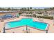 Inviting community pool surrounded by lounge chairs and a well-maintained patio area at 1 Boca Ciega Point Blvd # 310, St Petersburg, FL 33708