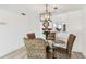 Comfortable dining area with a glass table and wicker chairs, perfect for Gathering meals at 1 Boca Ciega Point Blvd # 310, St Petersburg, FL 33708
