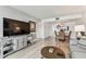 Cozy living space with dining area featuring a glass table, and an entertainment center at 1 Boca Ciega Point Blvd # 310, St Petersburg, FL 33708