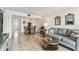 Open-concept living area with dining space and living room, showcasing modern decor and flooring at 1 Boca Ciega Point Blvd # 310, St Petersburg, FL 33708