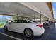 Car parked under a covered parking, great for protecting vehicles from sun and weather damage at 1 Boca Ciega Point Blvd # 310, St Petersburg, FL 33708