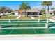 Enjoy the community shuffleboard court in a well maintained park-like setting on a sunny day at 1 Boca Ciega Point Blvd # 310, St Petersburg, FL 33708