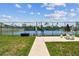 Well-maintained tennis court with fencing, landscaping, and seating for residents to enjoy outdoor activities at 1 Boca Ciega Point Blvd # 310, St Petersburg, FL 33708