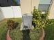 Landscaped backyard with lush green grass and white fencing at 10766 Standing Stone Dr, Wimauma, FL 33598