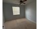 Empty bedroom with carpet and window at 10766 Standing Stone Dr, Wimauma, FL 33598