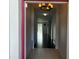 Inviting foyer with wood look flooring and views of the home's open layout at 10766 Standing Stone Dr, Wimauma, FL 33598