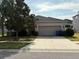 Charming single-story home featuring a two-car garage and well-maintained landscaping at 10766 Standing Stone Dr, Wimauma, FL 33598