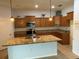 A spacious kitchen features granite counters, stainless appliances, and ample storage at 10766 Standing Stone Dr, Wimauma, FL 33598