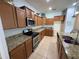 The kitchen offers granite countertops and stainless steel appliances at 10766 Standing Stone Dr, Wimauma, FL 33598