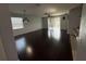 Bright and open living area with wood flooring and a ceiling fan at 10766 Standing Stone Dr, Wimauma, FL 33598