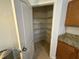 A walk-in pantry with tile flooring and wire shelving for optimal storage at 10766 Standing Stone Dr, Wimauma, FL 33598