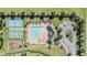 Bird's eye view of the community pool, playground, basketball court, and tennis court at 12745 Moorish Pl, Spring Hill, FL 34610