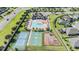 Overhead view of the community's recreational amenities, including pool, courts, playground, and clubhouse at 12745 Moorish Pl, Spring Hill, FL 34610