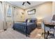 Cozy bedroom with a dark-framed bed, desk, neutral carpet, and a bright window with stylish curtains at 12745 Moorish Pl, Spring Hill, FL 34610