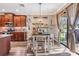 Dining area and kitchen with a sliding glass door and a backyard view at 12745 Moorish Pl, Spring Hill, FL 34610