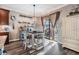 Charming dining area adjacent to the kitchen with sliding glass doors to the backyard at 12745 Moorish Pl, Spring Hill, FL 34610