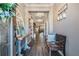 Inviting entryway with wood floors, decor, and a view into the open-concept living spaces at 12745 Moorish Pl, Spring Hill, FL 34610