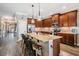 Spacious kitchen with granite counters, stainless steel appliances, and breakfast bar seating at 12745 Moorish Pl, Spring Hill, FL 34610