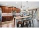 Updated kitchen featuring granite countertops, stainless appliances, island, and backyard views at 12745 Moorish Pl, Spring Hill, FL 34610
