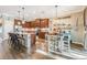 Bright kitchen with granite countertops, stainless steel appliances, and adjacent breakfast nook at 12745 Moorish Pl, Spring Hill, FL 34610
