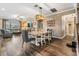 Open-concept living space with dining area, a comfortable couch, and seamless flow for entertaining at 12745 Moorish Pl, Spring Hill, FL 34610