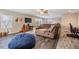 Bright living room featuring a comfortable seating area and large windows for natural light at 12745 Moorish Pl, Spring Hill, FL 34610