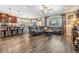Open-concept living area with a kitchen island, comfortable seating, and a bright, airy atmosphere at 12745 Moorish Pl, Spring Hill, FL 34610
