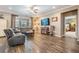 Cozy living room with plush seating, a large window, and stylish decor for a relaxing atmosphere at 12745 Moorish Pl, Spring Hill, FL 34610