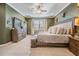 Expansive main bedroom featuring a beautifully dressed bed, stylish furniture, and great natural light at 12745 Moorish Pl, Spring Hill, FL 34610