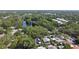 An aerial view of the neighborhood featuring mature trees and a tranquil pond at 1304 Withlacoochee St, Safety Harbor, FL 34695