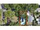 Aerial view of property highlighting the pool, backyard, and mature landscaping at 1304 Withlacoochee St, Safety Harbor, FL 34695