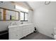 Elegant bathroom with double sinks, modern fixtures, and lots of storage at 1304 Withlacoochee St, Safety Harbor, FL 34695
