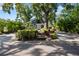 Charming home featuring a lush landscaped front yard and a welcoming entrance with stairs at 1304 Withlacoochee St, Safety Harbor, FL 34695
