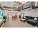 Spacious living room with exposed wood beams, an open layout and a modern kitchen in view at 1304 Withlacoochee St, Safety Harbor, FL 34695