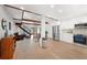 Bright open floor plan featuring hardwood floors and exposed beams and stairs at 1304 Withlacoochee St, Safety Harbor, FL 34695