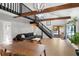 Inviting living room featuring hardwood floors, open beam architecture, and a comfortable seating area at 1304 Withlacoochee St, Safety Harbor, FL 34695