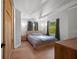 Bright main bedroom featuring vaulted ceilings, hardwood floors, and natural light at 1304 Withlacoochee St, Safety Harbor, FL 34695