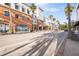 A street view of a commercial building with stores and restaurants and palm trees at 1304 Withlacoochee St, Safety Harbor, FL 34695