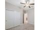 Bedroom featuring a ceiling fan and a closet for storage at 13213 Haystack Ct, Riverview, FL 33579