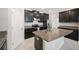 Modern kitchen with stainless steel appliances, granite countertops, a kitchen island, and tile flooring at 13213 Haystack Ct, Riverview, FL 33579